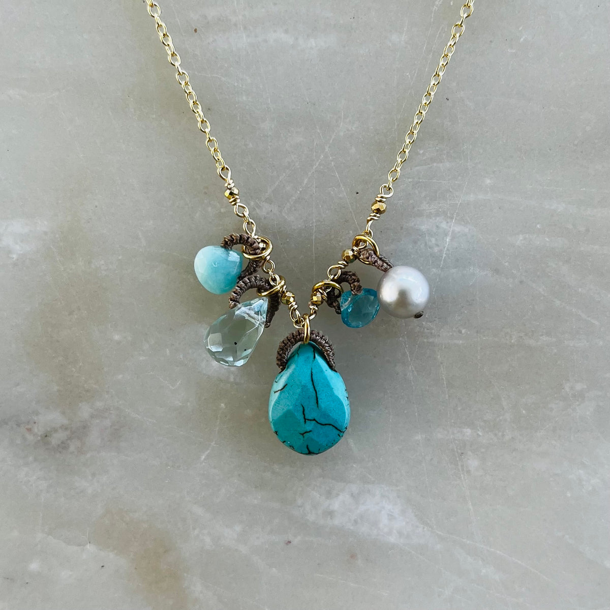 Turquoise drop necklace with mixed blue gemstones and pearl on silver chain