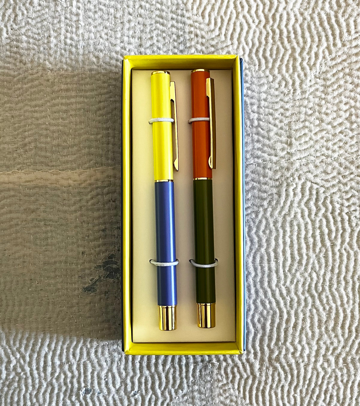 Two Color Block Pens in yellow box, one with cobalt blue barrel, one with army green barrel