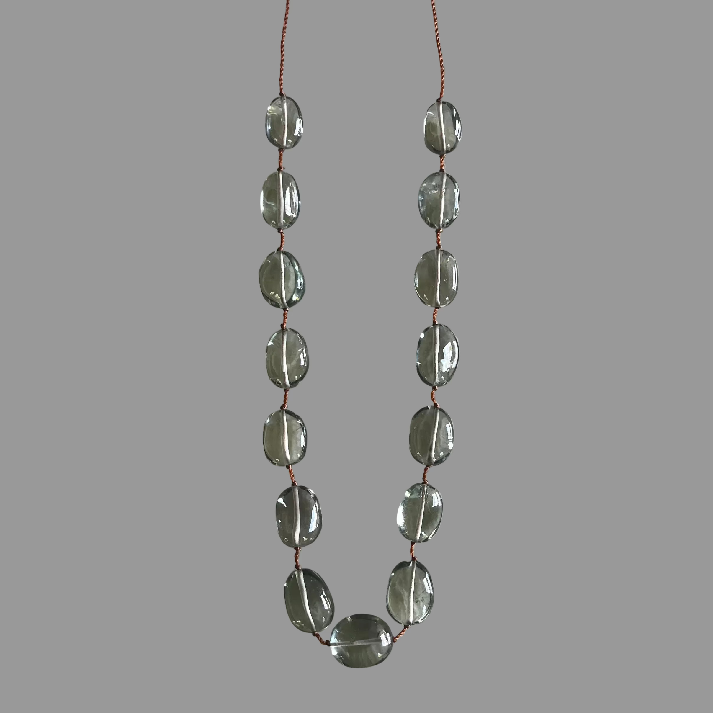Drops of Honey-Dew Necklace with translucent olive-green oval beads on brown cord