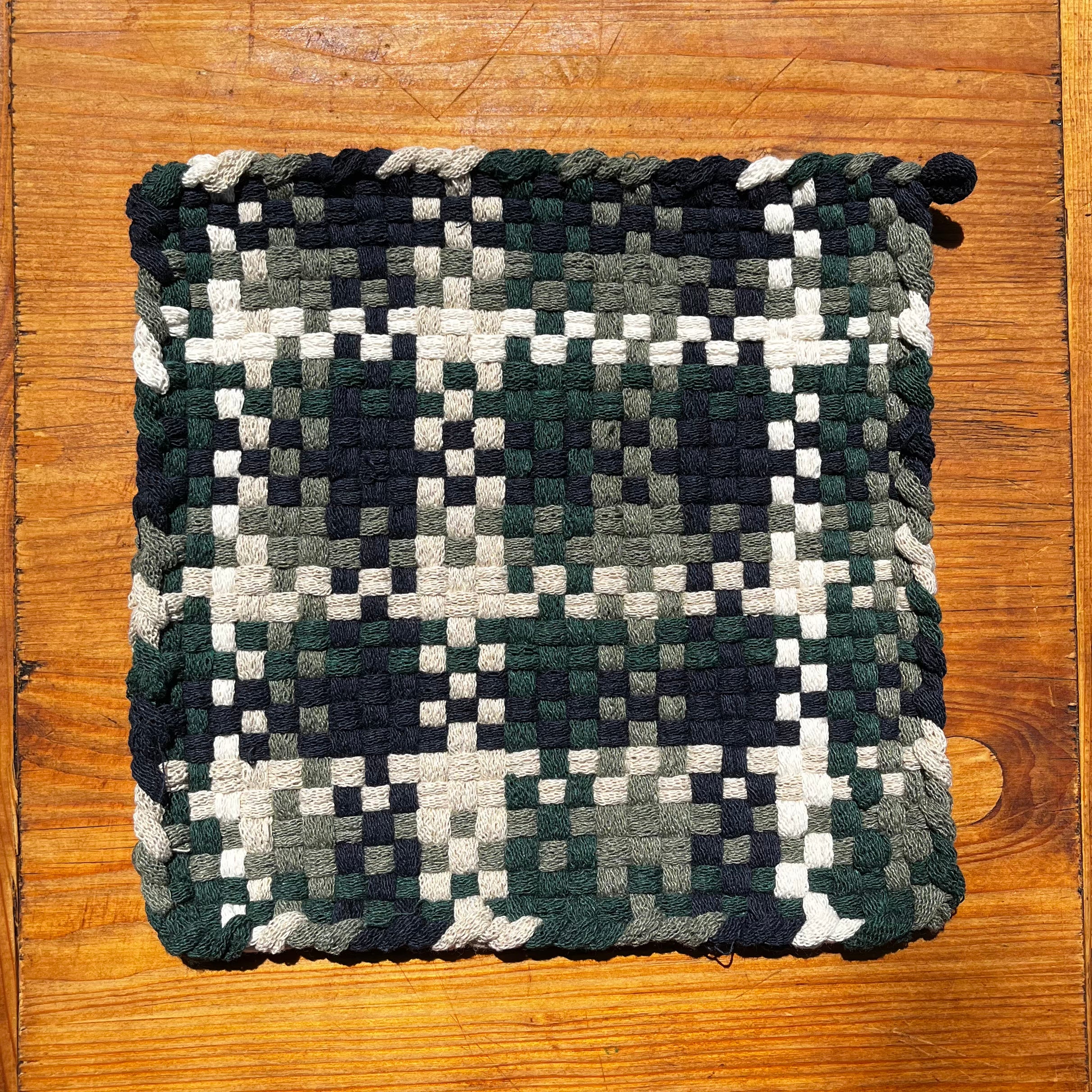 Wall of Ivy Potholder in woven checkerboard pattern of dark green, navy, white, and cream colors