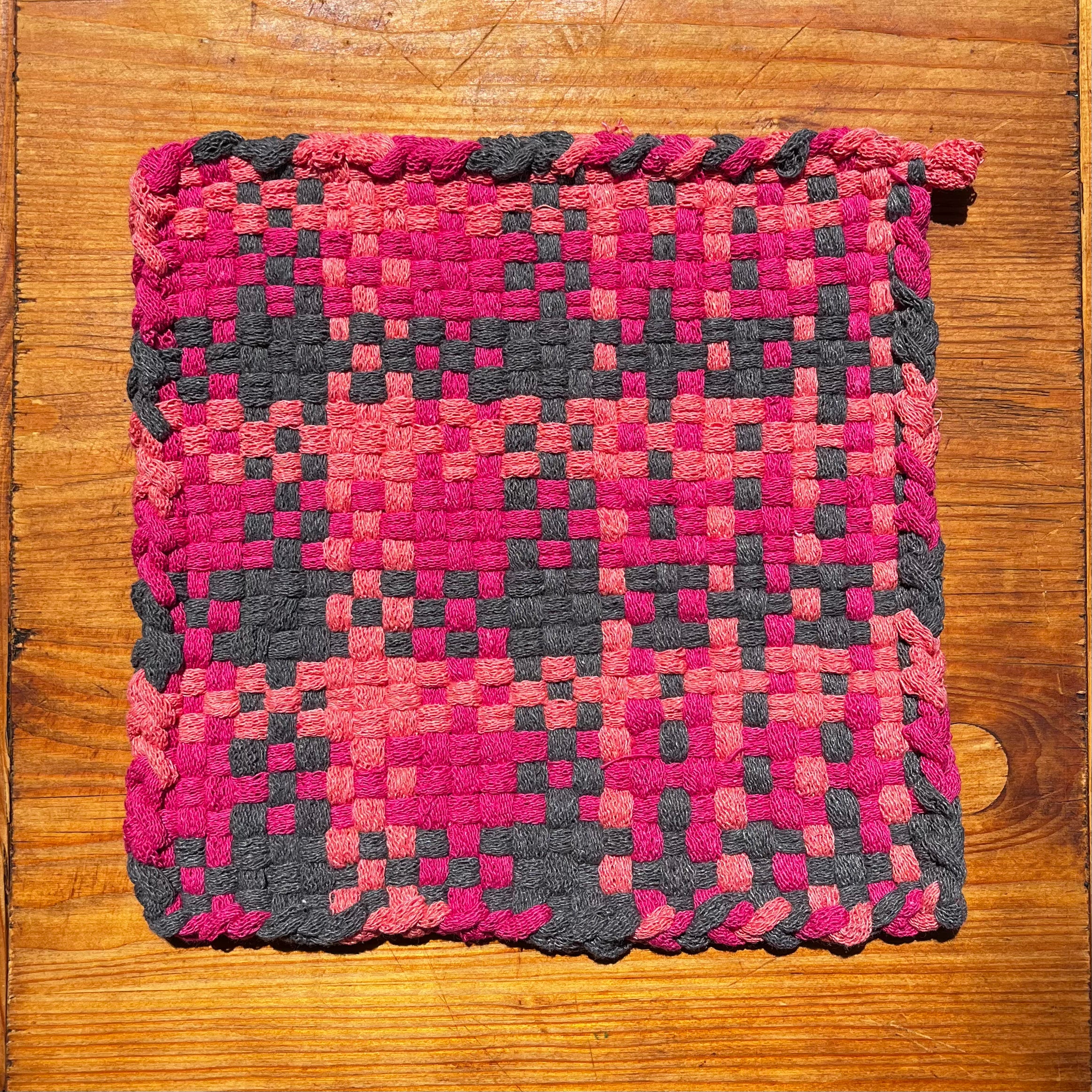 Ride and Shine Potholder with woven checkerboard pattern in pink, coral, and charcoal gray