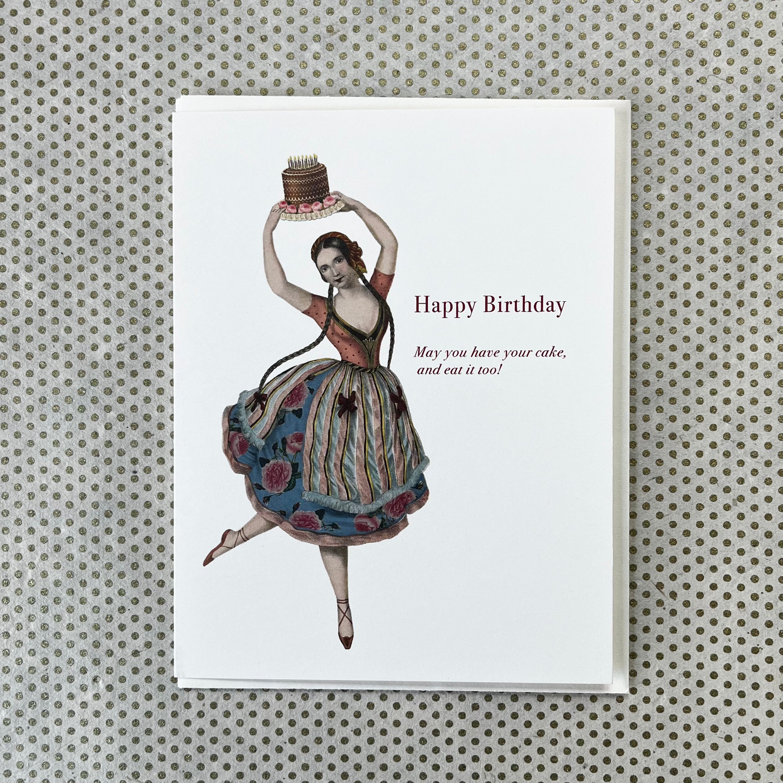 Birthday card featuring vintage ballerina illustration holding chocolate cake overhead, text reads Happy Birthday