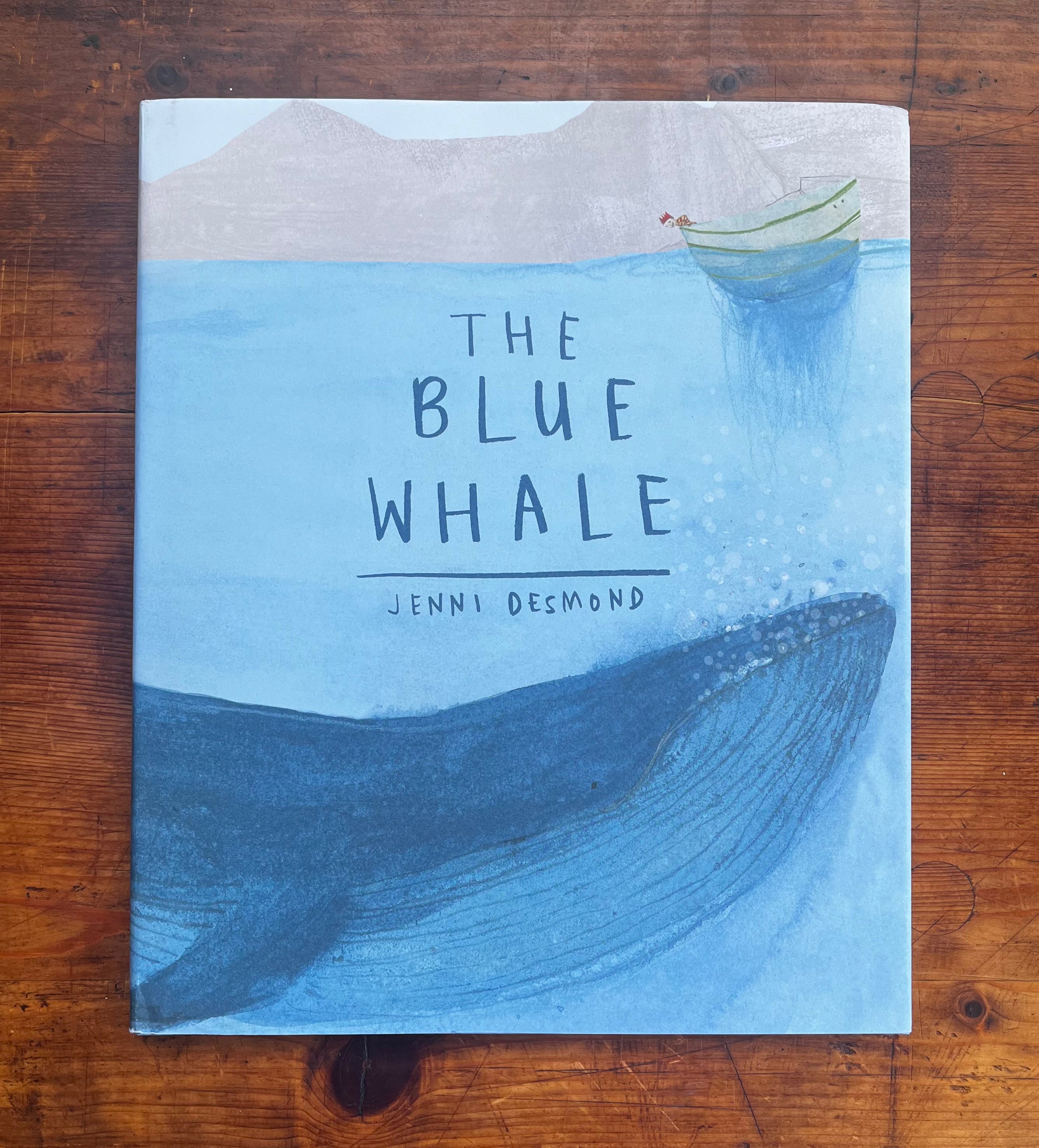 The Blue Whale book cover showing illustrated whale beneath small boat in ocean