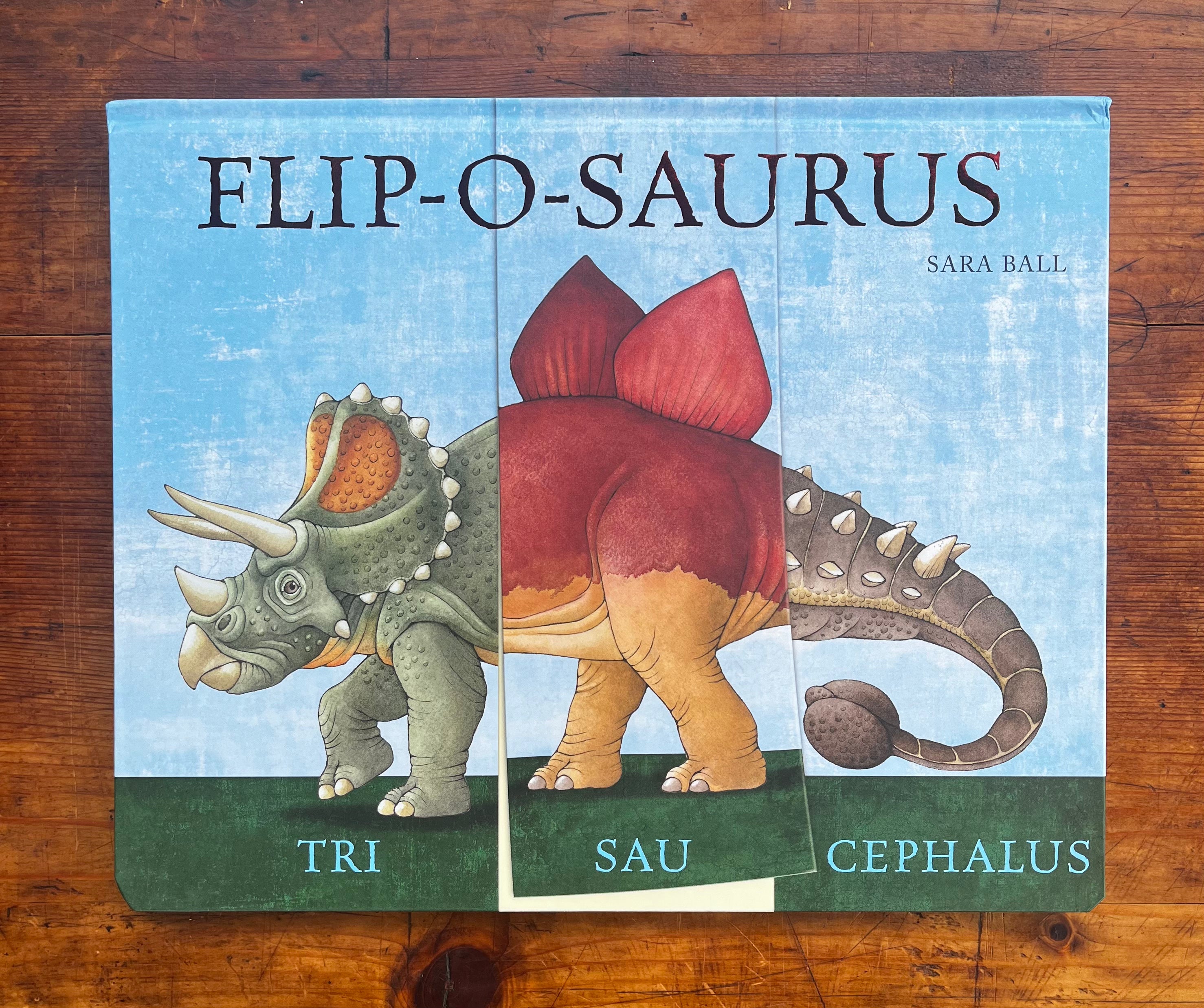 Flip-O-Saurus book cover showing three dinosaurs with flippable panels: Triceratops, Stegosaurus, Ankylosaurus