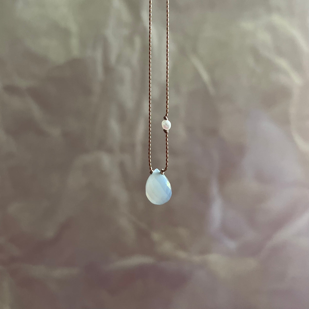 Grey moonstone teardrop pendant with pearl accent on delicate chain necklace