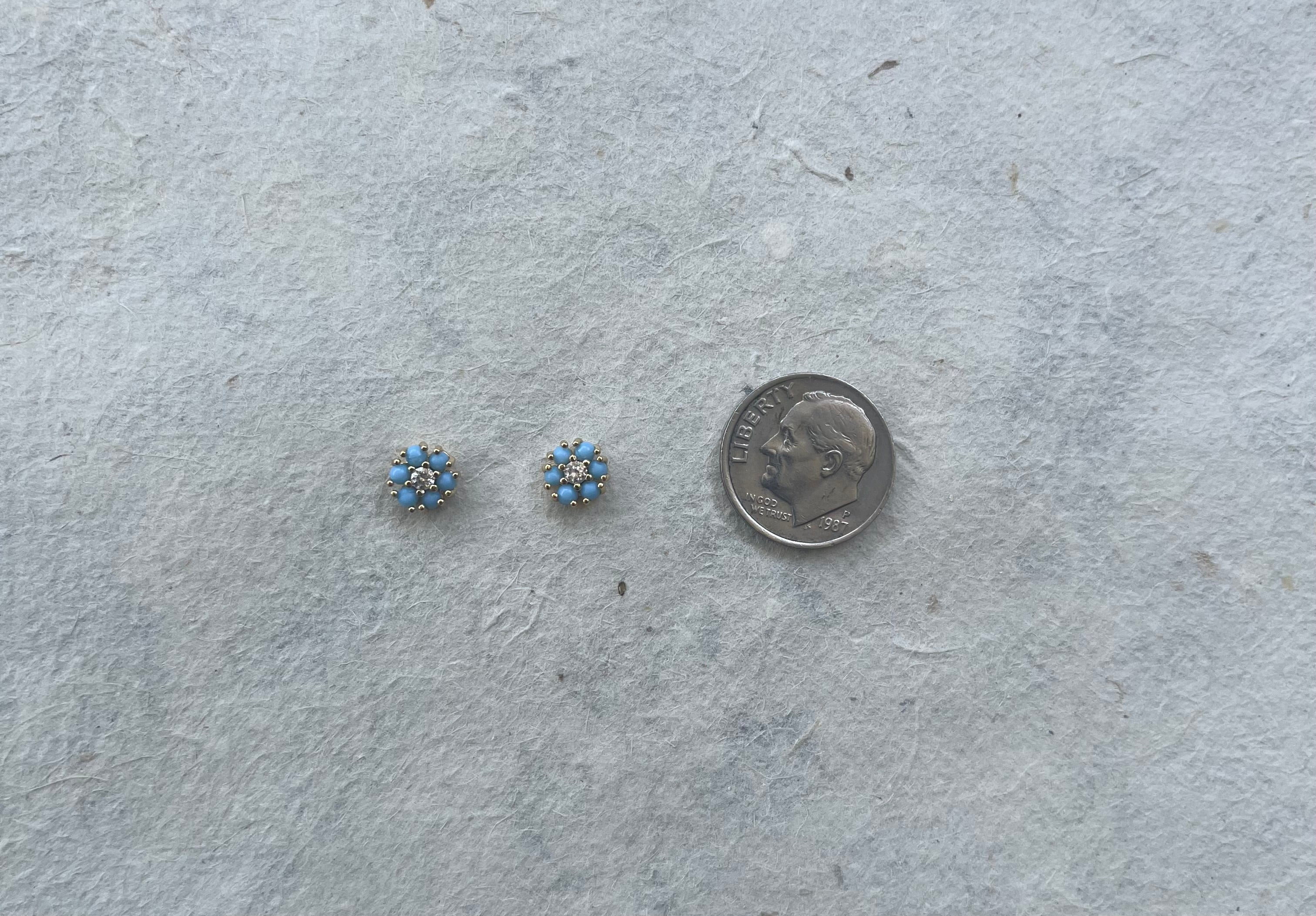 Pair of small turquoise and CZ stud earrings next to dime for size comparison