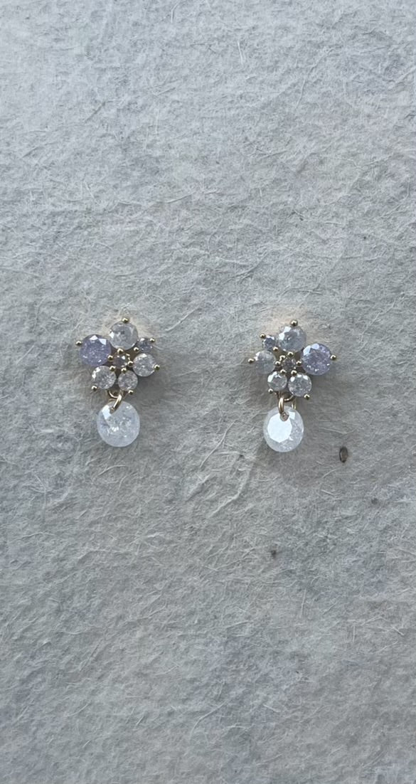 Lavender ombre flower stud earrings with dangling clear crystals on gray background