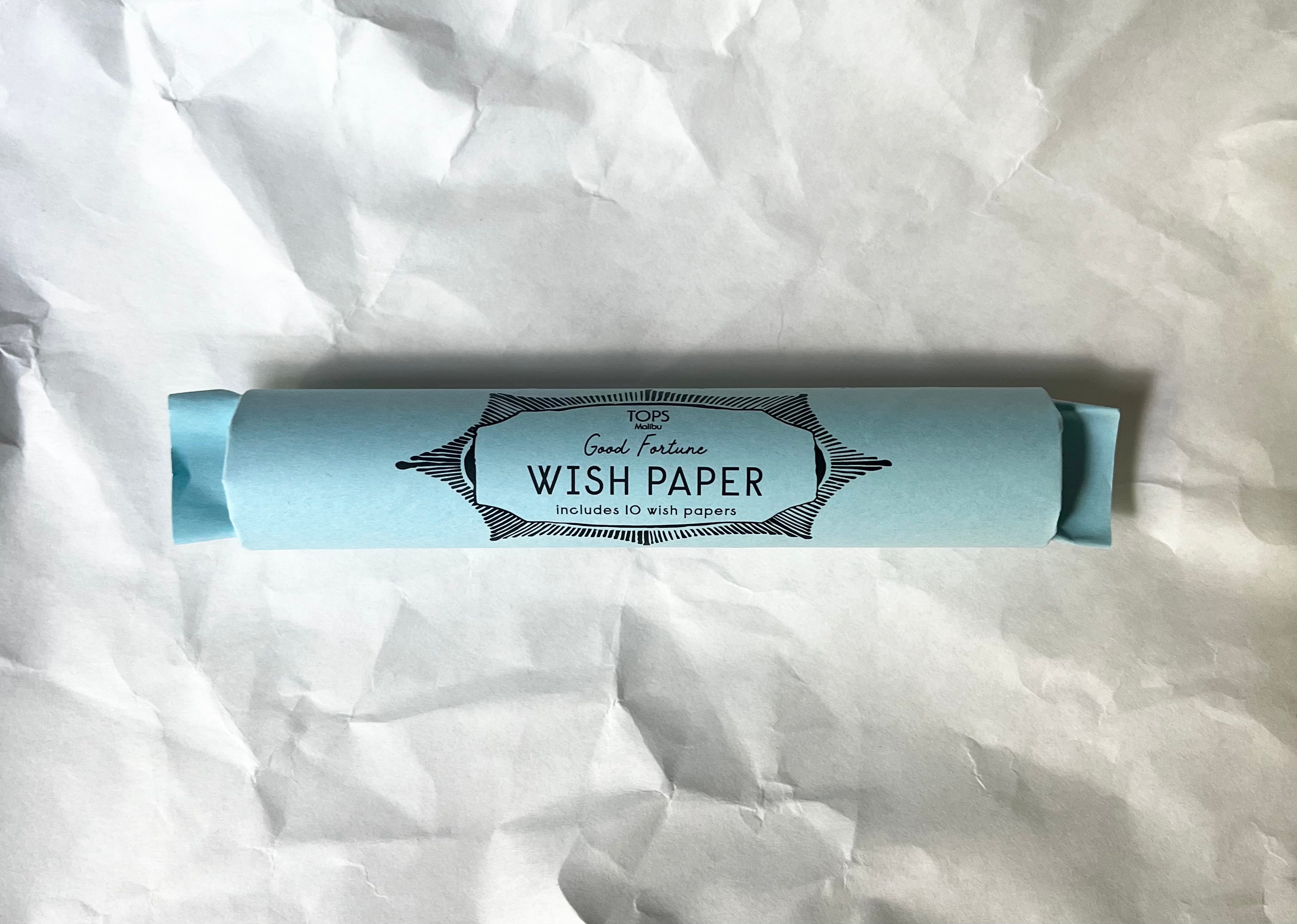 Light blue tube labeled Good Fortune Wish Paper contains 10 wish papers