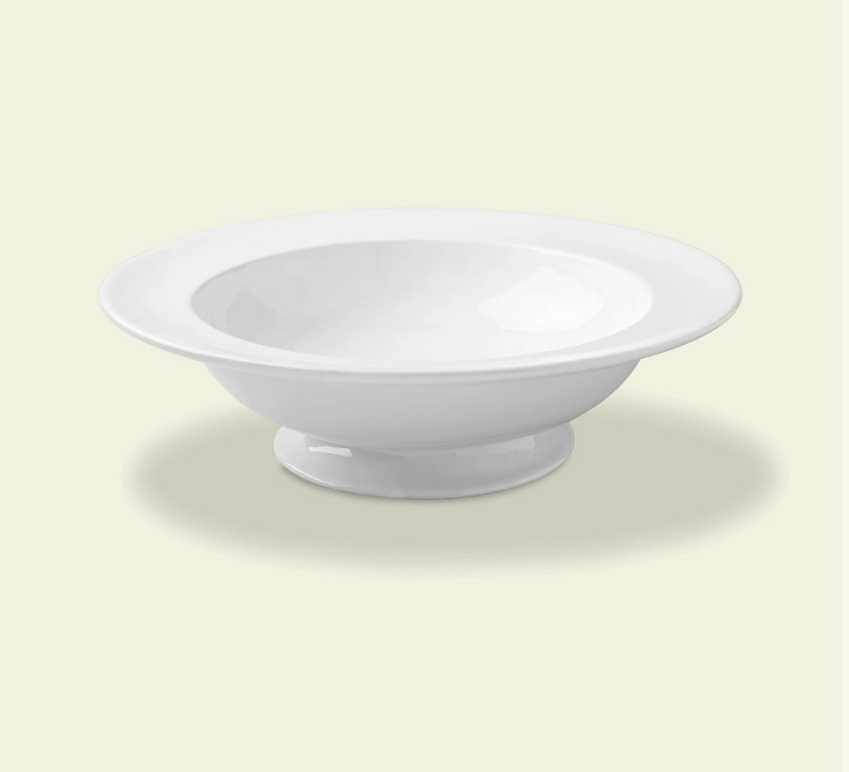 White porcelain footed serving bowl with wide rim and pedestal base
