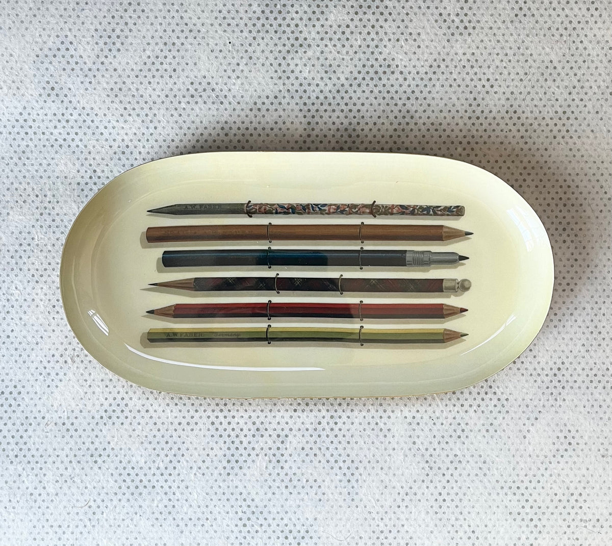 Enamel oval tray.  vintage pencils