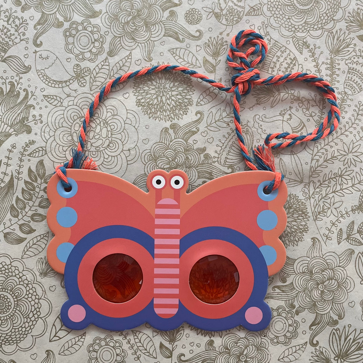 Butterfly prism lens
